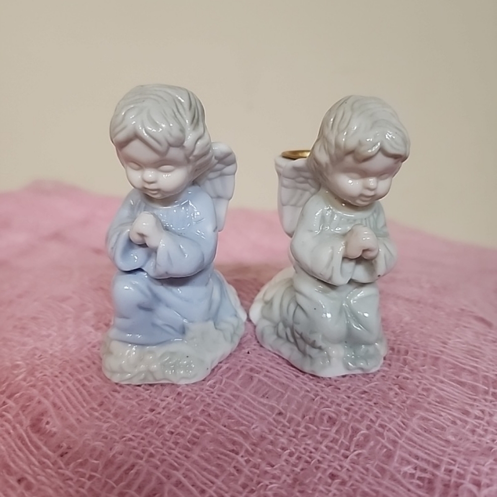 2 small figurines candle holders